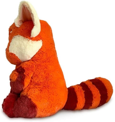 Red panda plush toy with a playful expression.