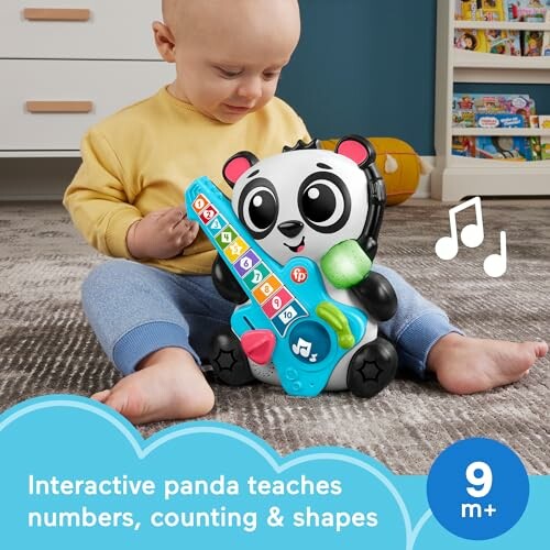 A baby playing with the interactive panda toy for learning numbers and shapes.