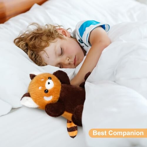 Child sleeping with a stuffed animal in bed.