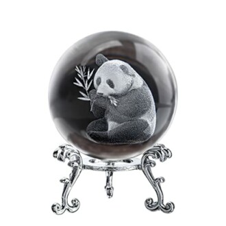 Crystal ball with etched panda holding bamboo on ornate stand