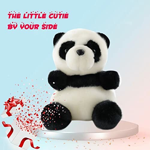 A plush panda toy with text 'The Little Cutie By Your Side' and a decorative ribbon.