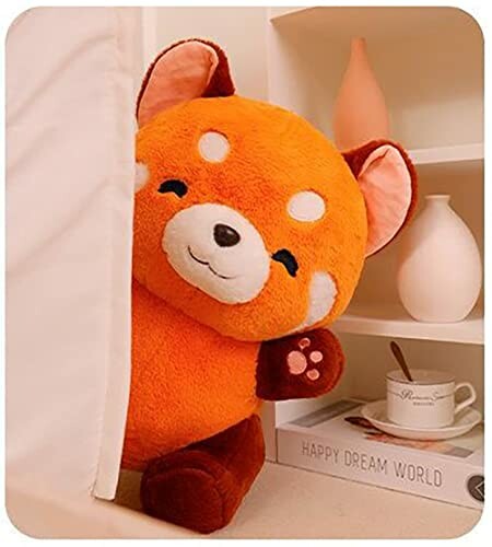 Giant plush red panda toy beside a shelf with decorative items