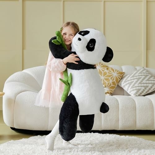 A girl hugging a large panda plush toy in a living room, showcasing its comfort and companionship.