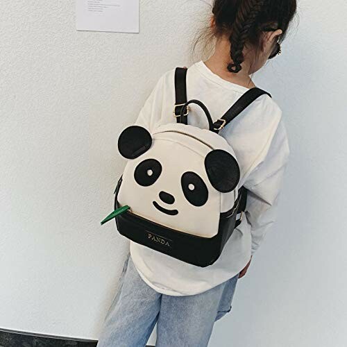 Child wearing a panda-themed backpack.