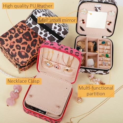 Leopard print jewelry boxes with compartments and mirror.