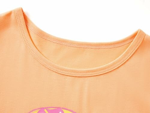 Peach-colored T-shirt collar close-up