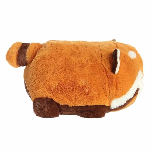 Side view of a plush red panda toy