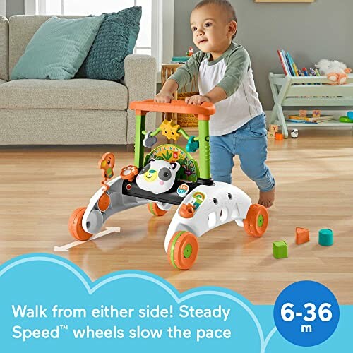 Toddler using a walker in a playroom with toys and a couch in the background.