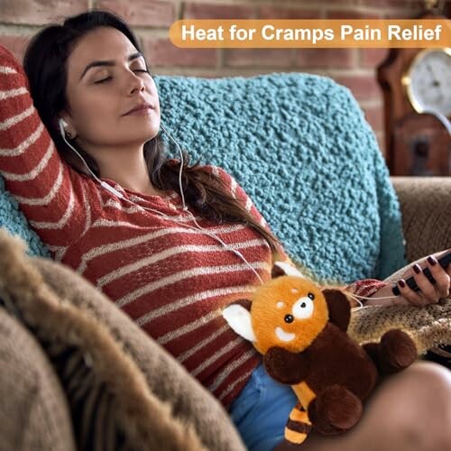 Woman using plush heating pad for cramps pain relief.